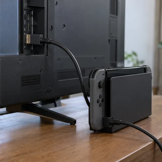 HDMIケーブルでドックに接続されたNintendo Switchに直接接続されたテレビの背面。両者の間にレシーバーは存在しない。