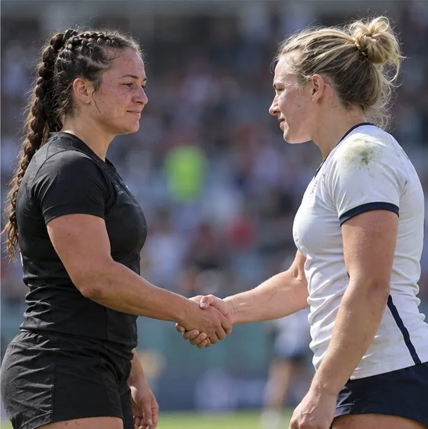 Two rugby sevens players shake hands after a match, representing the direct result between two teams tied in a pool.