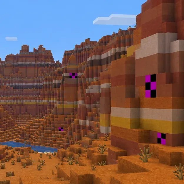 Purple and black missing-texture blocks appear on a Badlands cliff while the surrounding terrain renders normally.