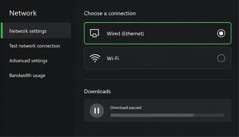 Network settings showing Wired Ethernet selected, Wi-Fi as another option, and a download paused
