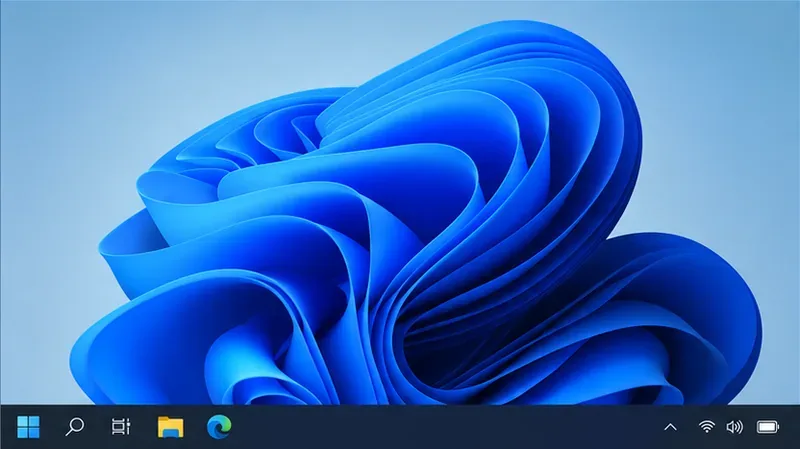 Un escritorio de Windows 11 sin ventanas de aplicaciones abiertas y solo con los iconos estándar de la barra de tareas visibles.