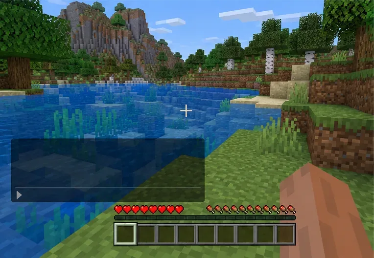 Bedrock gameplay at a riverbank with the chat panel open; command availability and chat controls vary by platform.