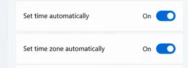 Windows Date and Time controls showing automatic time and time-zone settings switched on.