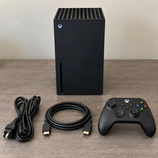 Xbox Series X console, wireless controller, power cord, and HDMI cable laid out on a table